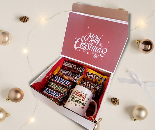 box con snickers m&ms, hersheys milky way y taza navideña