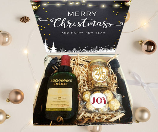 box con whisky buchanans ferrero rocherr y frasco con botanas saladas